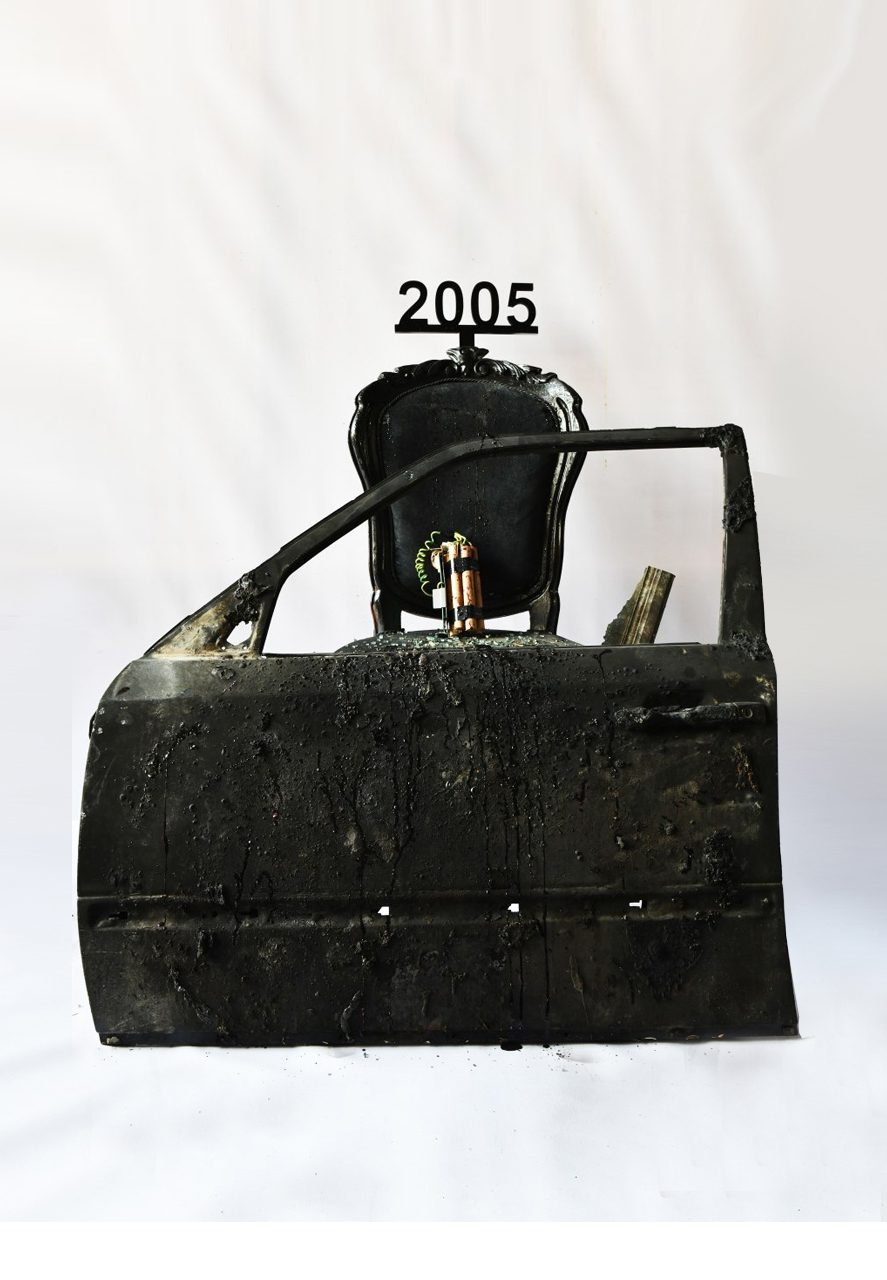 1 of 16, 2005. A car door and dynamite, fused to the seat.