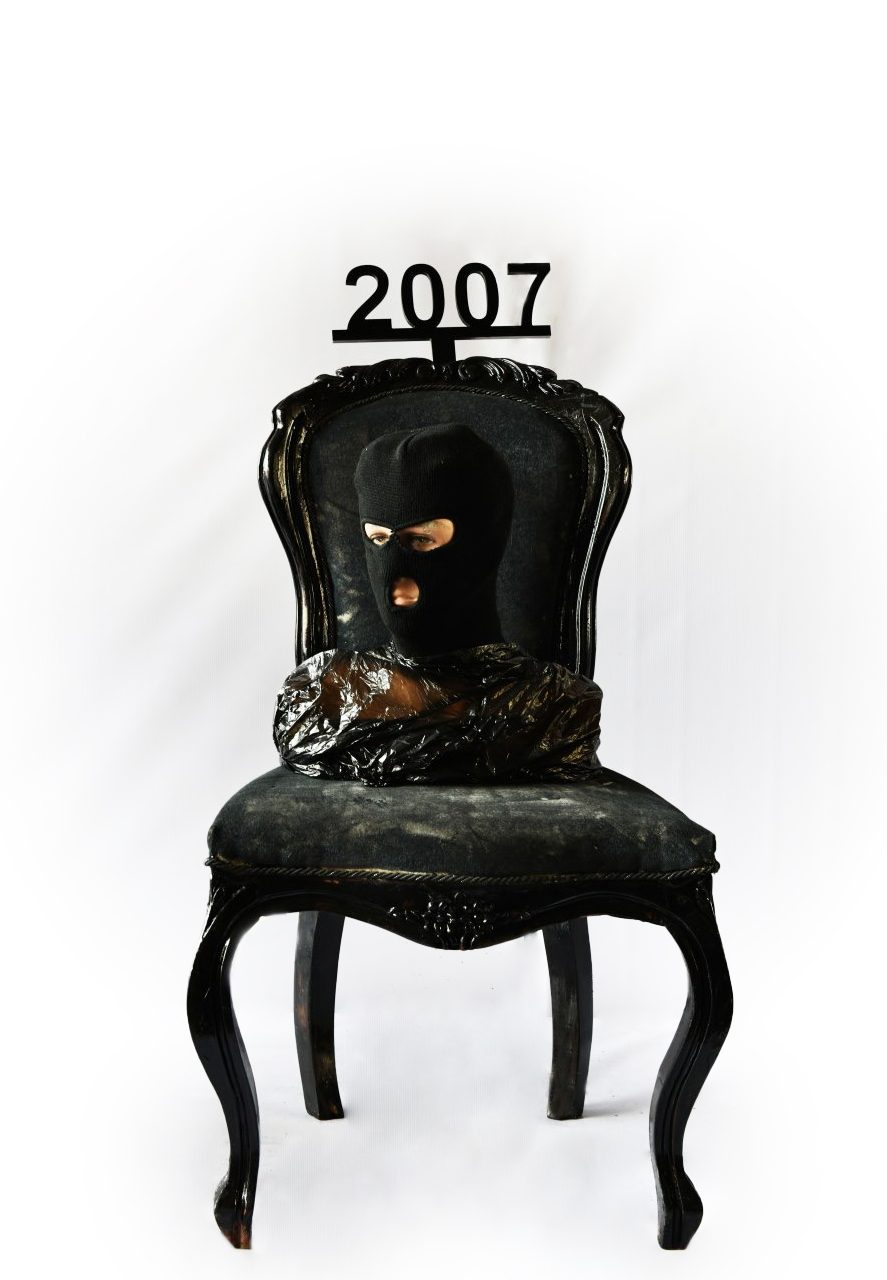 1 of 16, 2007. A masked figure. The war goes anonymous.