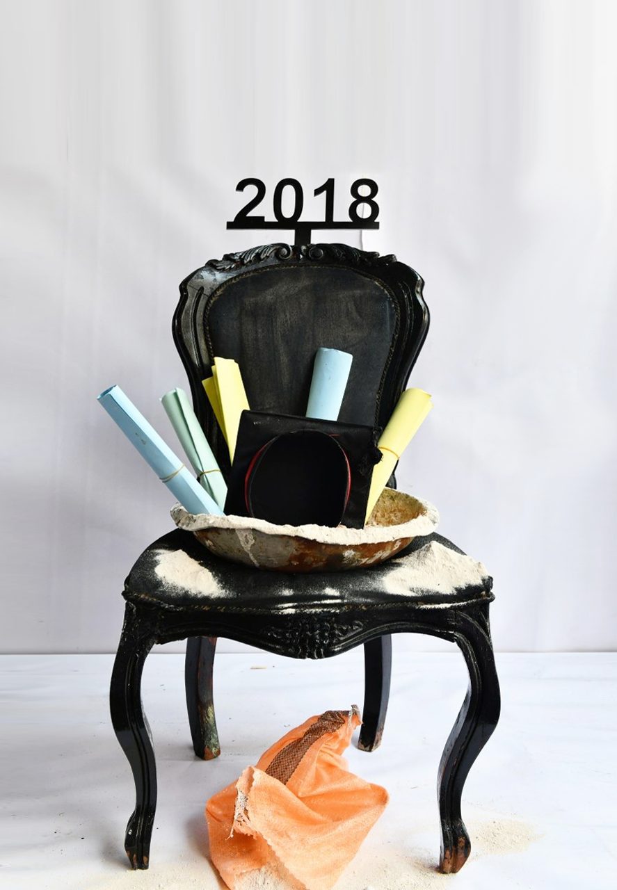 1 of 16, 2018. Diplomas rolled in dust, a generation waiting to build.